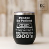 Black 12 oz stainless steel wine tumbler laser engraved with a retro cassette and text “Please be patient, I’m from the 1900s”.