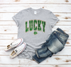 Faux Glitter Style Lucky Women's St. Patrick's Day T-Shirt - Gray  Trendy Soft Unisex St. Patrick's Day T-Shirt. Perfect, casual, cute St. Patrick's Day look!